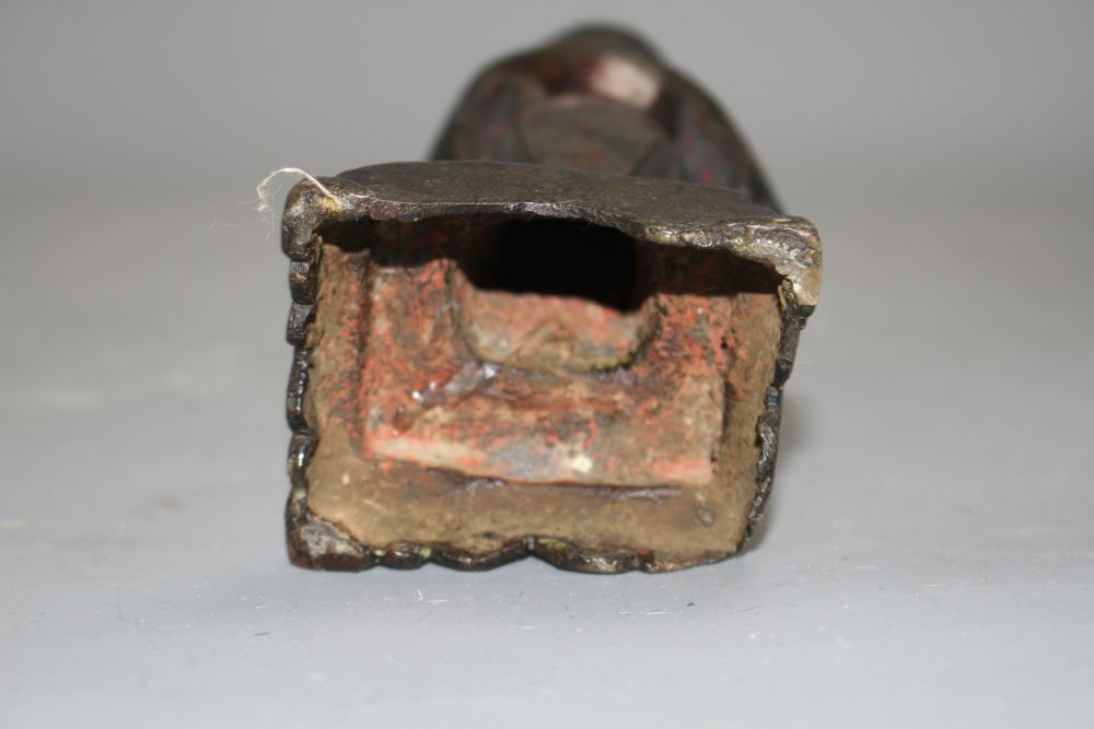 A 17th century Chinese bronze figure, with remnants of polychrome lacquer, h.16cm